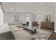 Cozy living room featuring an oversized sectional sofa, neutral color palette, and modern decor at 1410 S Los Altos Dr, Chandler, AZ 85286