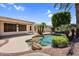 Backyard pool with tropical landscaping, perfect for relaxing and entertaining guests outdoors at 1410 S Los Altos Dr, Chandler, AZ 85286