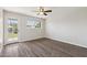 Empty bedroom boasts wood-look flooring, natural light and backyard access at 1452 E Gary St, Mesa, AZ 85203