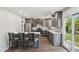 Contemporary kitchen with stainless steel appliances, a breakfast bar, and convenient access to the patio at 1452 E Gary St, Mesa, AZ 85203