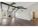 Bright living room featuring vaulted ceilings, exposed beams, and a cozy fireplace at 1452 E Gary St, Mesa, AZ 85203