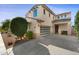 Inviting two-story home featuring a well-manicured front yard and a convenient two-car garage at 1502 E Goldcrest St, Gilbert, AZ 85297