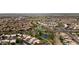 Community aerial showcasing verdant landscaping and picturesque ponds, offering a tranquil living environment at 15235 S 30Th St, Phoenix, AZ 85048