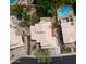 Overhead aerial view featuring a home with a pool, lush landscaping, and a well-manicured yard at 15235 S 30Th St, Phoenix, AZ 85048