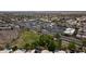 Extensive aerial view showcasing houses and a commercial center in an active community setting at 15235 S 30Th St, Phoenix, AZ 85048