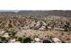 Sweeping aerial shot of houses nestled in desert with mountain views in the community at 15235 S 30Th St, Phoenix, AZ 85048