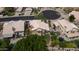 Expansive aerial view of a home with a spacious backyard, lush landscaping, and a pool at 15235 S 30Th St, Phoenix, AZ 85048