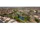 Community aerial view highlighting ponds and landscaping amid tile-roofed homes in a beautiful setting at 15235 S 30Th St, Phoenix, AZ 85048