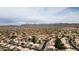 Scenic aerial of community nestled against picturesque mountains, showcasing tiled roofs and desert landscape at 15235 S 30Th St, Phoenix, AZ 85048