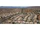 Wide aerial view of community showcasing neat landscaping and homes against a backdrop of scenic mountains at 15235 S 30Th St, Phoenix, AZ 85048