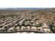 Comprehensive aerial view of a community with pools, greenery, and mountain landscapes at 15235 S 30Th St, Phoenix, AZ 85048