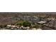 An aerial view of community with houses, a commercial center, and native desert landscaping at 15235 S 30Th St, Phoenix, AZ 85048