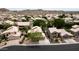 Picturesque aerial view of a home in a quiet neighborhood near desert mountains at 15235 S 30Th St, Phoenix, AZ 85048