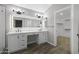Modern bathroom featuring a double vanity, quartz countertops, and stylish light fixtures at 15235 S 30Th St, Phoenix, AZ 85048