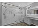 Modern bathroom with glass-enclosed shower and marble floors at 15235 S 30Th St, Phoenix, AZ 85048