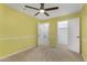 Bright bedroom with a ceiling fan and carpeted floors at 15235 S 30Th St, Phoenix, AZ 85048