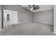 Large bedroom with vaulted ceilings and carpeted floors at 15235 S 30Th St, Phoenix, AZ 85048