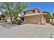 Inviting two-story home featuring a spacious driveway, a two-car garage, and charming curb appeal at 15235 S 30Th St, Phoenix, AZ 85048