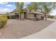 Charming home with desert landscaping, a two-car garage, and a neat front yard at 15235 S 30Th St, Phoenix, AZ 85048