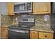 Well-equipped kitchen features granite counters and stainless steel appliances at 15235 S 30Th St, Phoenix, AZ 85048