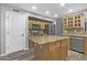 Well-equipped kitchen with a center island, stainless steel appliances, and tile backsplash at 15235 S 30Th St, Phoenix, AZ 85048