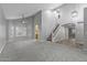 Inviting open living room with high ceilings, carpet, and stairs leading to an upper level at 15235 S 30Th St, Phoenix, AZ 85048