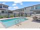 Community pool area featuring a pool, spa, outdoor seating, and barbecue grill at 1555 E Ocotillo Rd # 16, Phoenix, AZ 85014