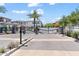 Community entry gate with well-manicured landscaping and secure access at 1555 E Ocotillo Rd # 16, Phoenix, AZ 85014