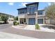 Stunning two-story home with a modern design, balcony, two-car garage, and landscaped front yard at 1555 E Ocotillo Rd # 16, Phoenix, AZ 85014