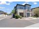 Beautiful two-story home with a modern design, balcony, two-car garage, and landscaped front yard at 1555 E Ocotillo Rd # 16, Phoenix, AZ 85014