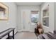 Bright foyer with a modern door, large windows, stylish console table, and hardwood staircase at 1555 E Ocotillo Rd # 16, Phoenix, AZ 85014