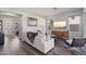 Spacious living room with hardwood floors, modern furniture, stylish decor, and plenty of natural light at 1555 E Ocotillo Rd # 16, Phoenix, AZ 85014