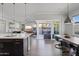 Open layout showcasing kitchen, dining, and living area, enhanced by natural light and backyard access at 1555 E Ocotillo Rd # 16, Phoenix, AZ 85014