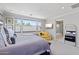Bright main bedroom showcases a seating area, serene decor, and an ensuite bathroom at 1555 E Ocotillo Rd # 16, Phoenix, AZ 85014