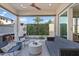 Stylish outdoor living space with comfortable seating, a modern fan, and a lush green wall at 1555 E Ocotillo Rd # 16, Phoenix, AZ 85014
