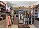Organized walk-in closet with custom shelving and ample storage space for clothes and shoes at 1555 E Ocotillo Rd # 16, Phoenix, AZ 85014