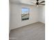 Clean bedroom with large window that provides an airy, peaceful atmosphere at 16236 W La Ventilla Way, Goodyear, AZ 85338