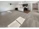 Open concept kitchen and living room with a ceiling fan and stainless steel appliances at 16236 W La Ventilla Way, Goodyear, AZ 85338