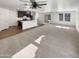 Bright living room offers ample space and seamless flow to the kitchen at 16236 W La Ventilla Way, Goodyear, AZ 85338