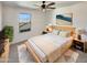 Cozy main bedroom with a queen bed and soft, natural lighting at 16236 W La Ventilla Way, Goodyear, AZ 85338