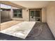 Covered patio with sliding glass doors and a concrete floor at 16236 W La Ventilla Way, Goodyear, AZ 85338