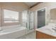 Bright bathroom with separate tub and shower, double sink vanity and closet at 1642 E Desert Ln, Phoenix, AZ 85042