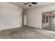 Spacious bedroom with a sliding glass door and an attached covered patio at 1642 E Desert Ln, Phoenix, AZ 85042