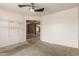 Bedroom featuring a ceiling fan, neutral carpet and wire shelving for closet organization at 1642 E Desert Ln, Phoenix, AZ 85042