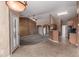 Bright living space features tile flooring, neutral paint, and easy access to kitchen at 1642 E Desert Ln, Phoenix, AZ 85042