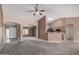 Open-concept living room with arched doorways and a breakfast bar overlooking the kitchen at 1642 E Desert Ln, Phoenix, AZ 85042