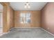 Inviting living room area featuring neutral walls, carpet flooring, and natural lighting from a window at 1642 E Desert Ln, Phoenix, AZ 85042