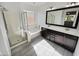 Elegant bathroom with a shower, soaking tub, double vanity, and modern finishes at 19904 W Sherman St, Buckeye, AZ 85326