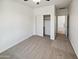 A standard bedroom with carpet floors, ceiling fan, a closet, and neutral walls at 19904 W Sherman St, Buckeye, AZ 85326
