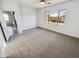 Inviting bedroom featuring a large window, carpet flooring, and a view of the neighborhood at 19904 W Sherman St, Buckeye, AZ 85326